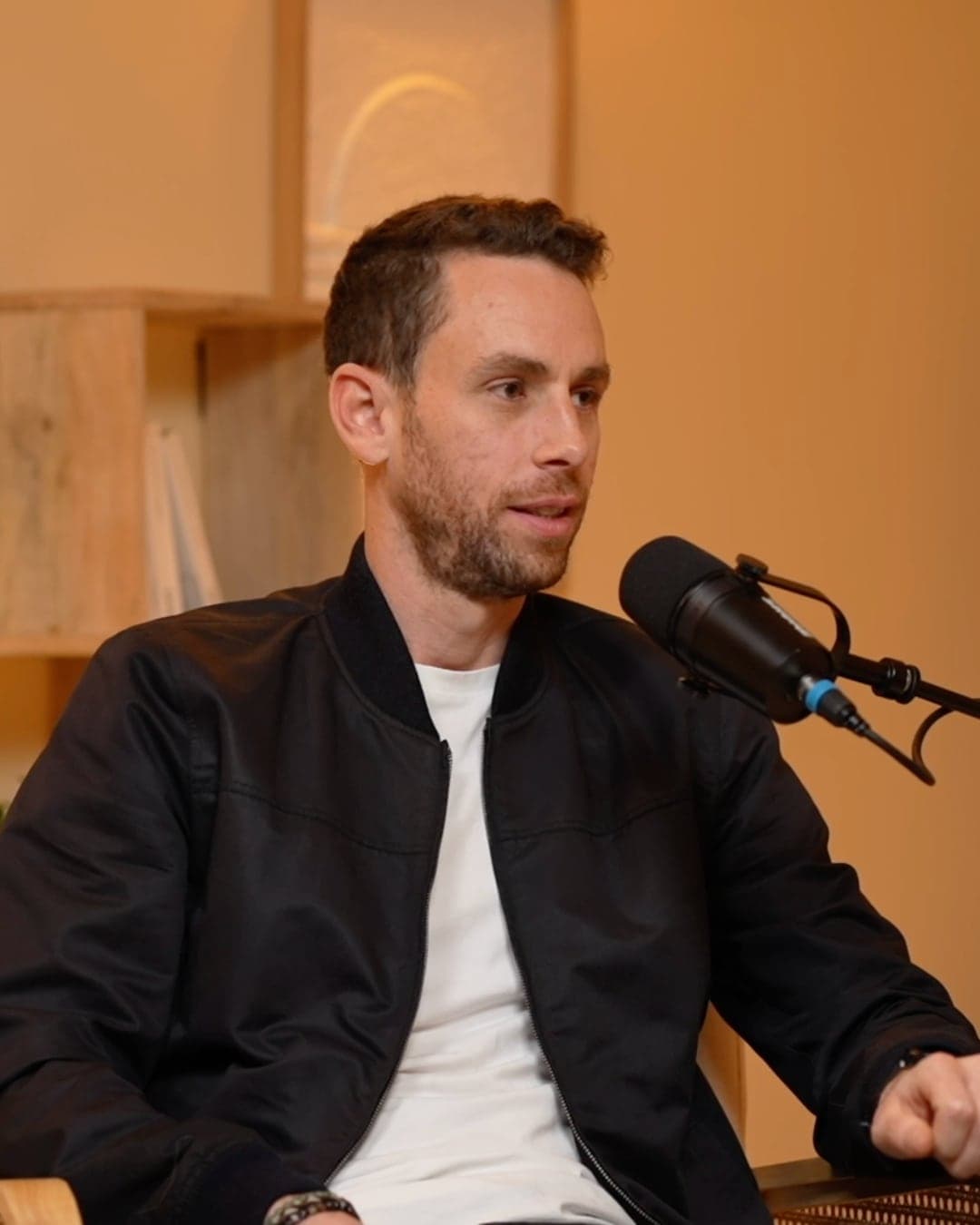 Adrien Hardy speaking into a studio microphone